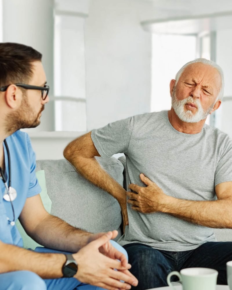 nurse-senior-ache-backache-home-care-patient-pain-YJKHJQ7.jpg